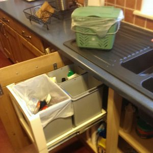 Kitchen caddy above; segregated waste containers below